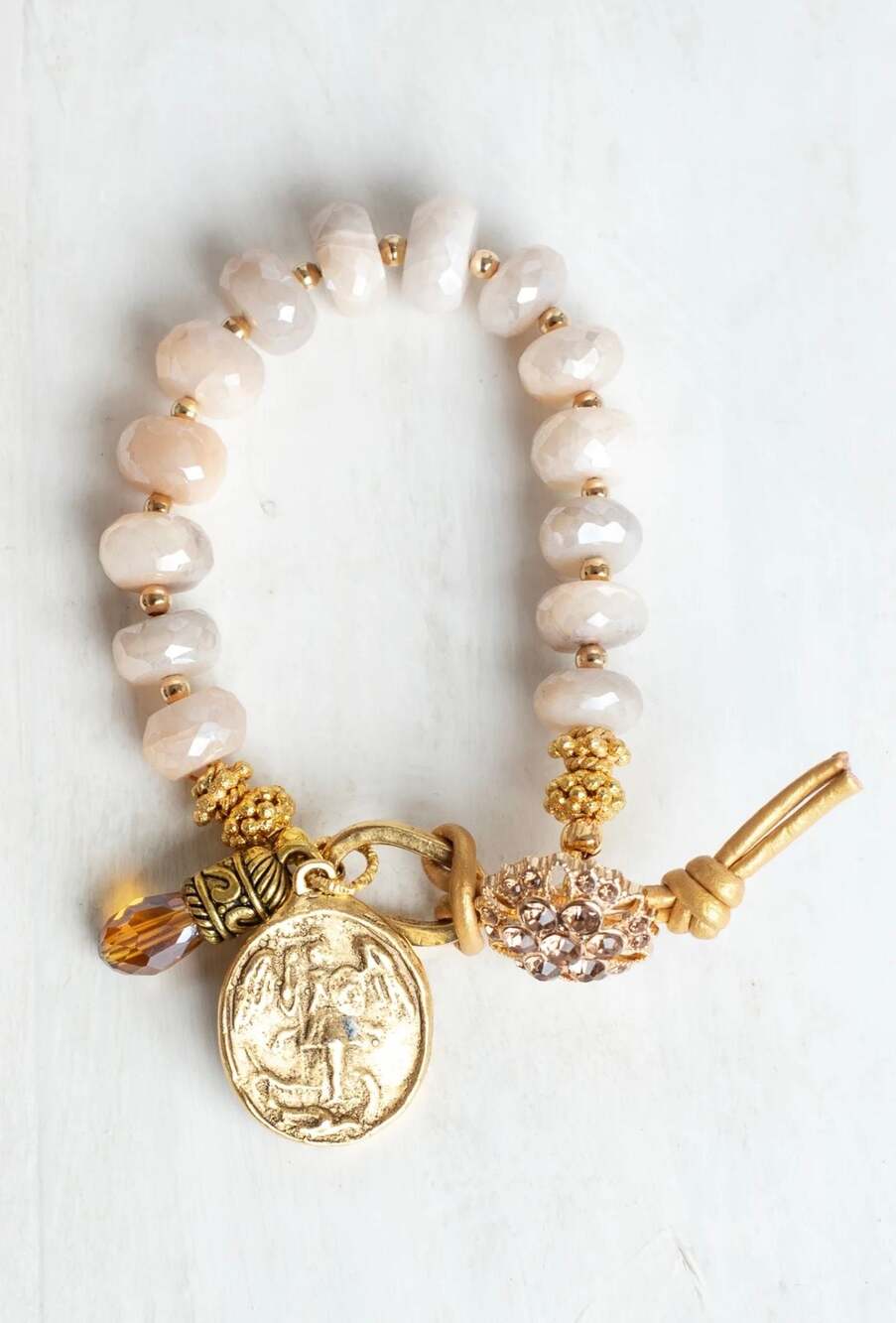 Gifts of Grace Designs Coated Sapphire Bracelet with Angel Cross Gold Charm